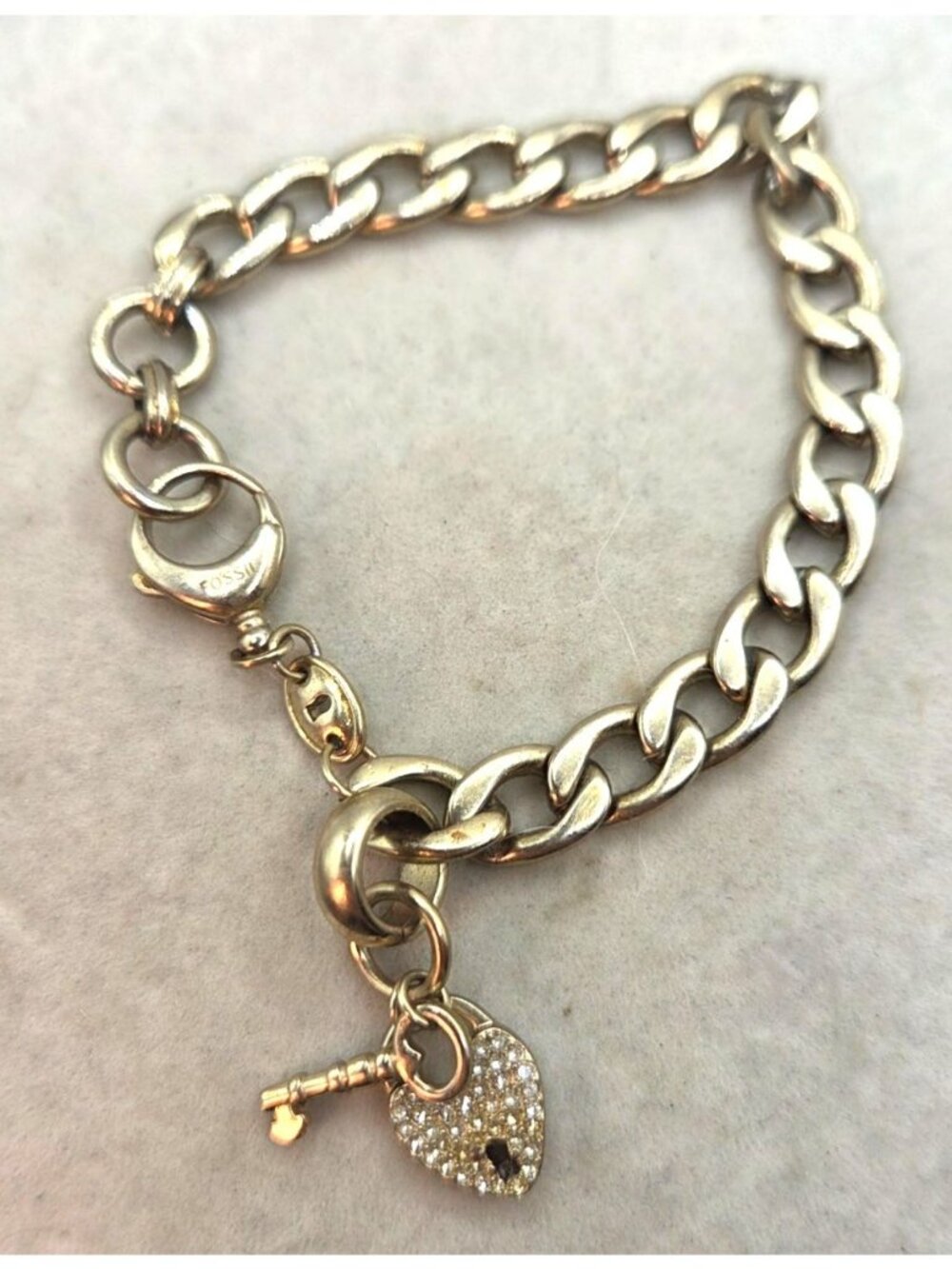 FOSSIL GOLD TONE S/STEEL CRYSTAL PAVE KEY HEART LOCK CHARMS BRACELET